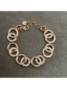 Absolute rose gold tone circular interlocking chain-link rhinestone bracelet